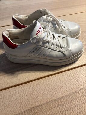 Prada White Leather Sneakers with Red Heel Tab